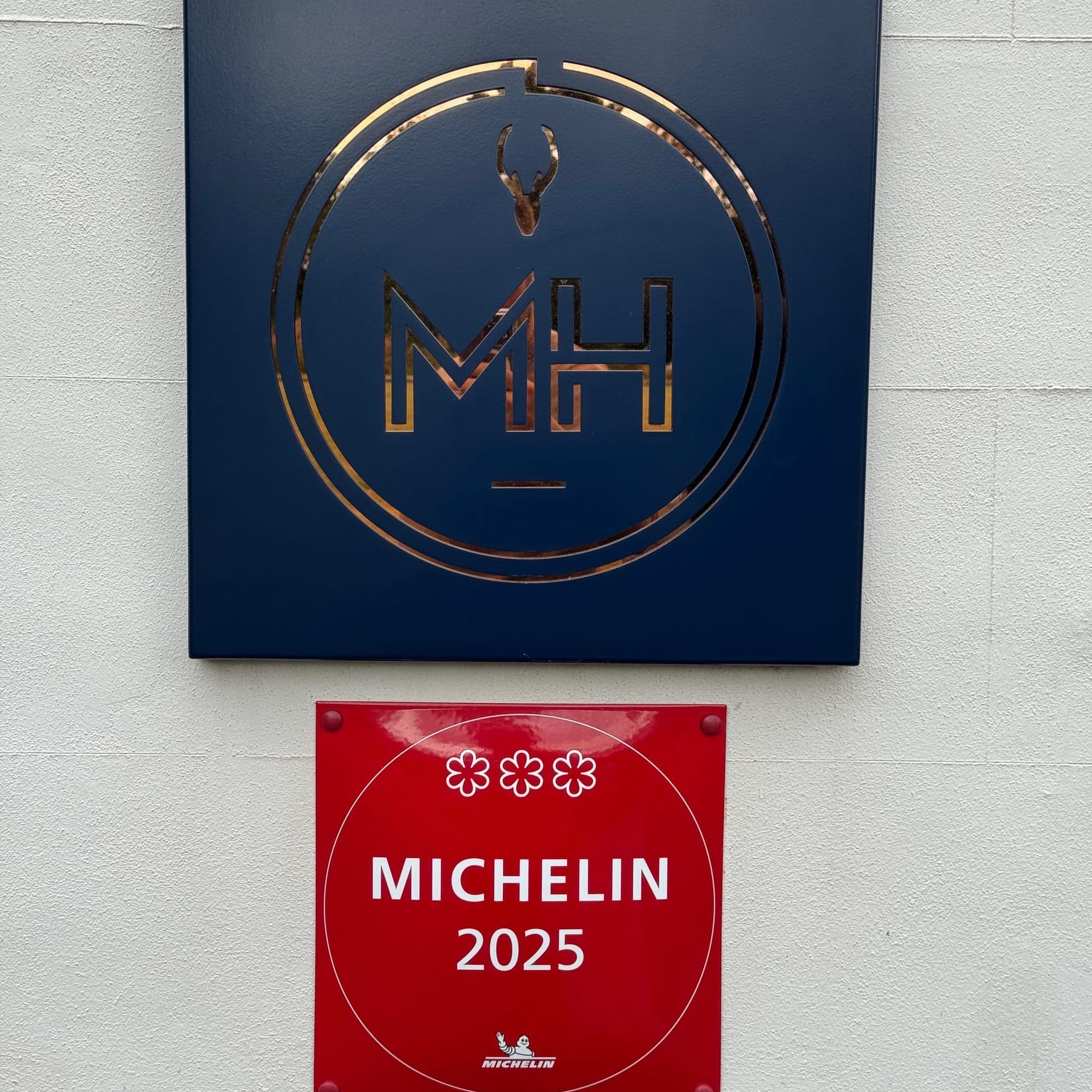 Michelin 2025 three-star plaque at Moor Hall restaurant in the United Kingdom.