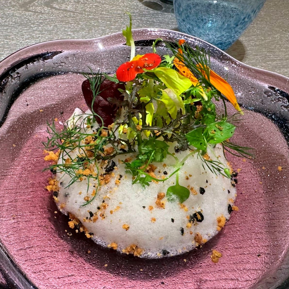 The vegetables garden, Scottish smoked salmon, arugula cream, lemon mousse, tomato vinaigrette and black olive crumble.